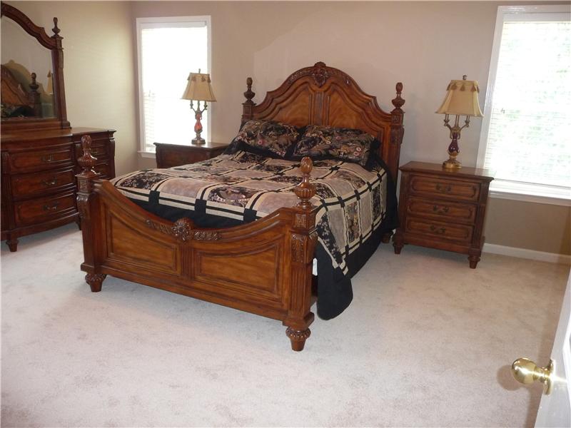 Master bedroom is large and filled with light from 3 windows.