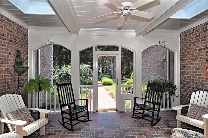 Relaxing screened in porch with skylights